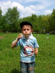 Young Boy Blowing Bubbles